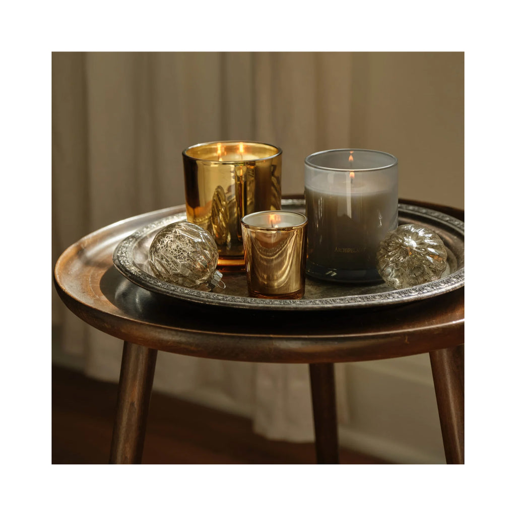 Archipelago Silver Balsam Credenza Candle, three candles lit on a table thumbnail 3