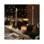 Archipelago Winter Frost Tapered Candle, two white candles lit on a table