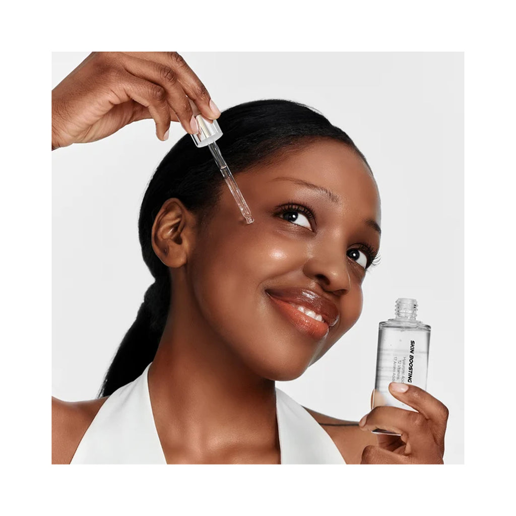 Essenciel Skin Boosting Forte Ampoule, woman applying serum to face with dropper thumbnail 3
