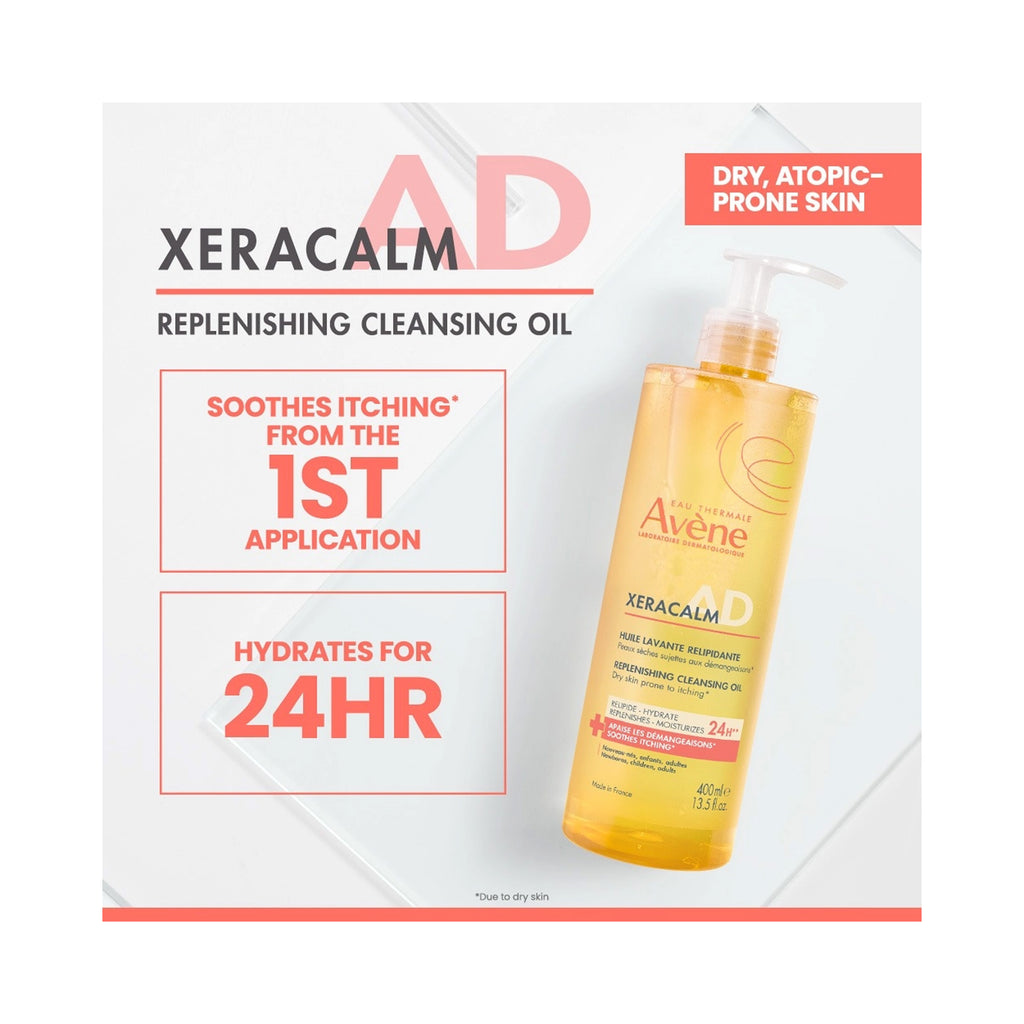 A bottle of Avene Xeracalm AD Replenishing Cleansing Oil shown on a white promotional graphic with red and black text callouts. The bottle is transparent and filled with golden-yellow oil, with a pump dispenser. thumbnail 3